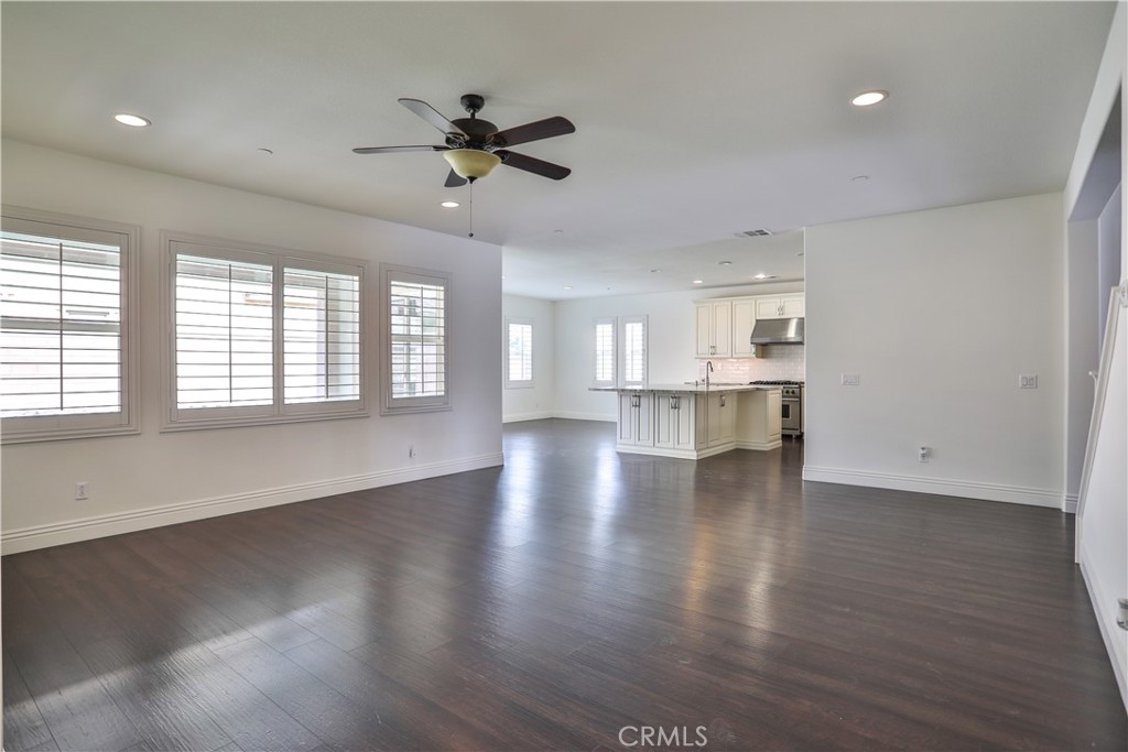 2795 Devonshire Lane Ontario, CA 91762 - Photo 12 of 50 a view of an empty room with wooden floor and a window