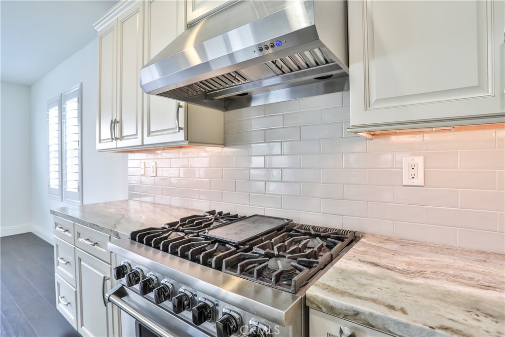2795 Devonshire Lane Ontario, CA 91762 - Photo 18 of 50 a stove top oven sitting inside of a kitchen