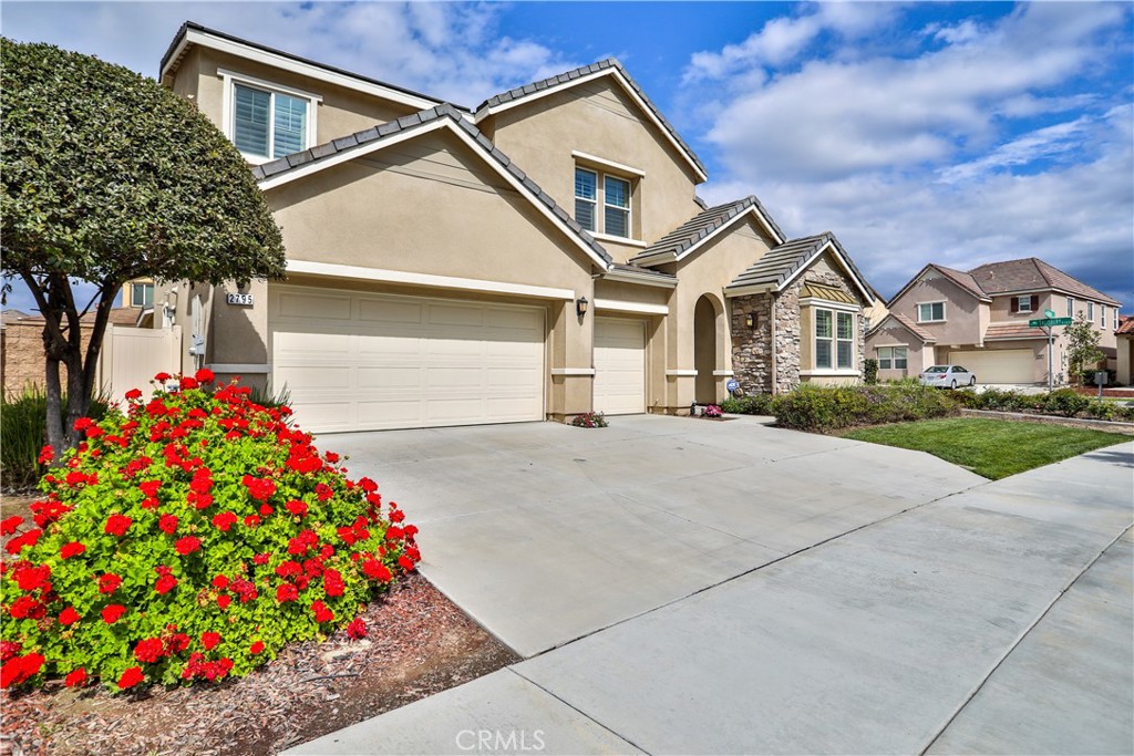 2795 Devonshire Lane Ontario, CA 91762 - Photo 2 of 50 a front view of a house with a yard and garage
