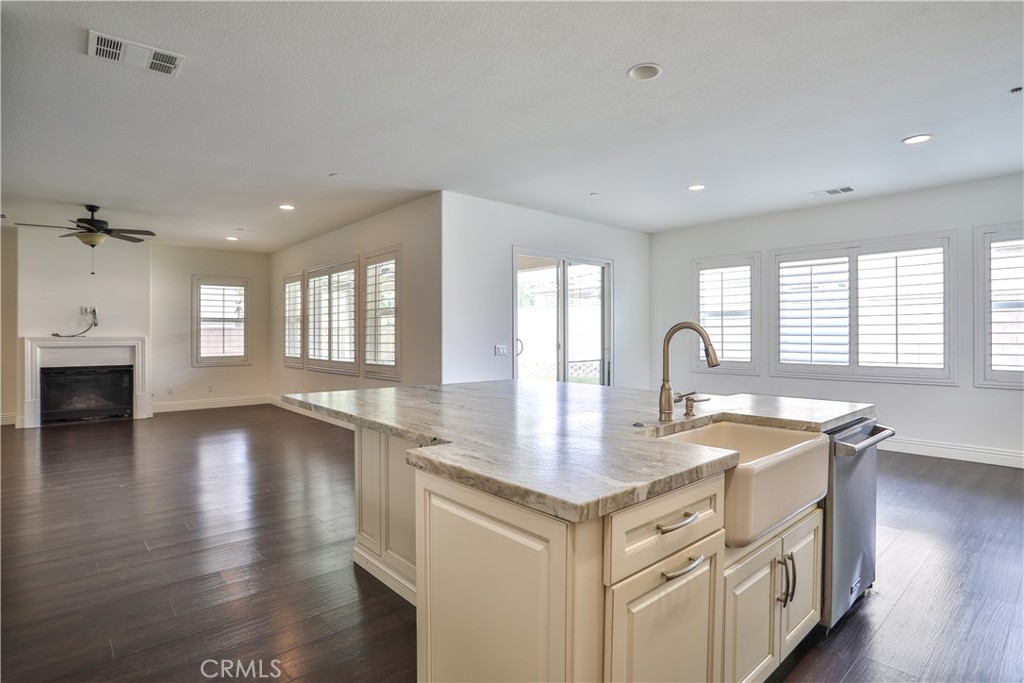 2795 Devonshire Lane Ontario, CA 91762 - Photo 22 of 50 a kitchen with a sink stove and cabinets