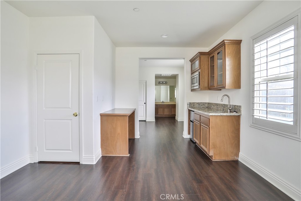 2795 Devonshire Lane Ontario, CA 91762 - Photo 28 of 50 a view of a kitchen cabinets and wooden floor