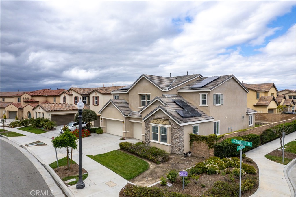 2795 Devonshire Lane Ontario, CA 91762 - Photo 3 of 50 a front view of a house with garden