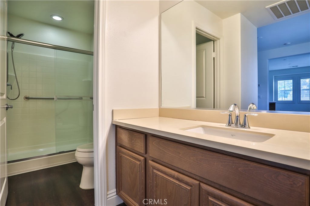 2795 Devonshire Lane Ontario, CA 91762 - Photo 32 of 50 a bathroom with a sink and a mirror