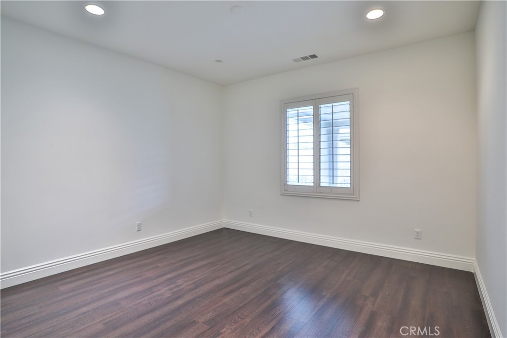 2795 Devonshire Lane Ontario, CA 91762 - Photo 33 of 50 wooden floor in an empty room with a window
