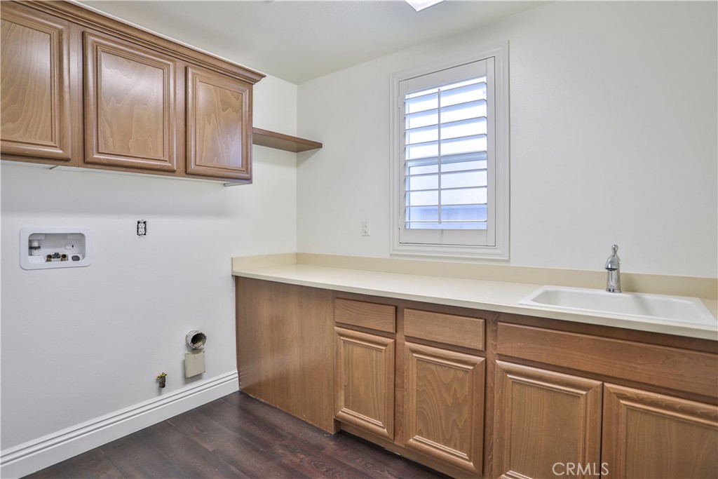 2795 Devonshire Lane Ontario, CA 91762 - Photo 34 of 50 a bathroom with a sink and a window