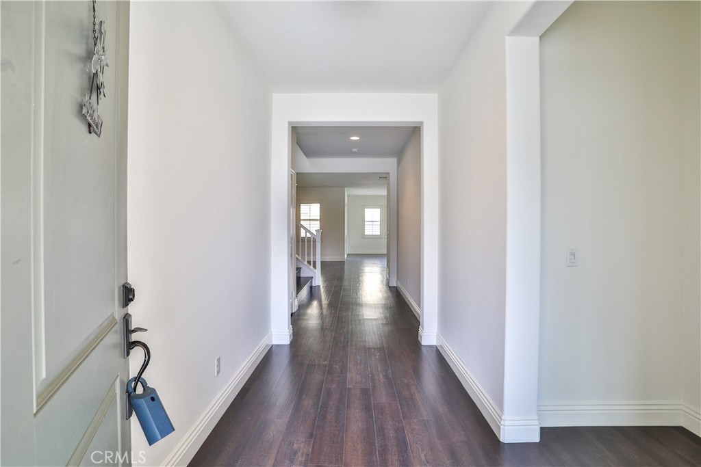 2795 Devonshire Lane Ontario, CA 91762 - Photo 7 of 50 a view of a hallway with wooden floor