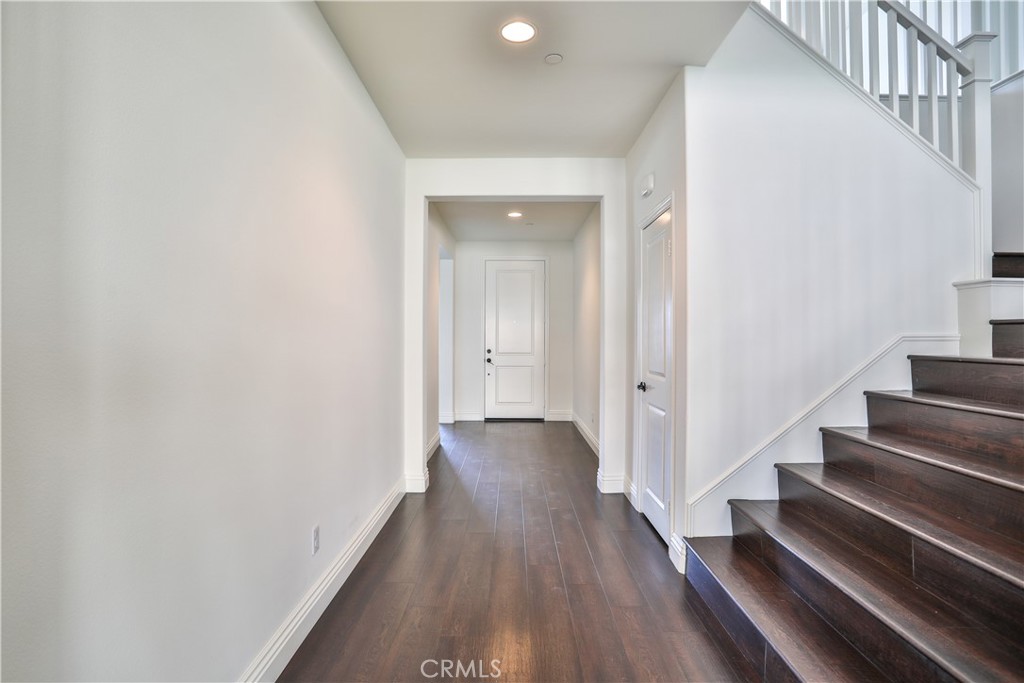 2795 Devonshire Lane Ontario, CA 91762 - Photo 8 of 50 a view of a hallway with wooden floor and entryway
