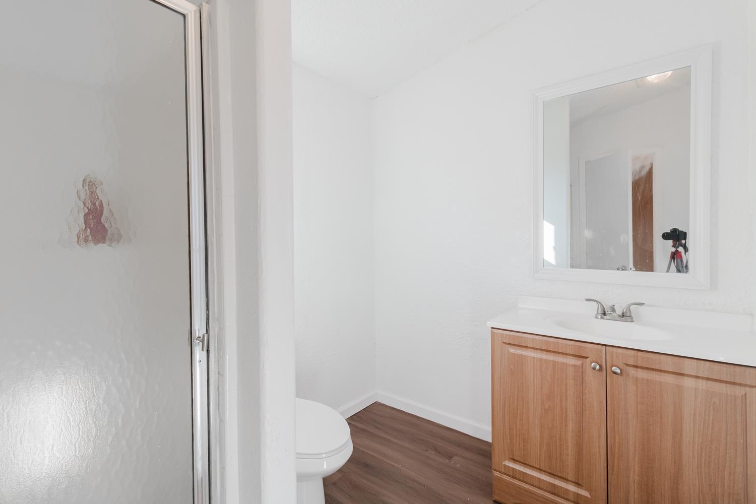 216 California Loop Sacramento, CA 95823 - Photo 20 of 42 a bathroom with a sink and a mirror