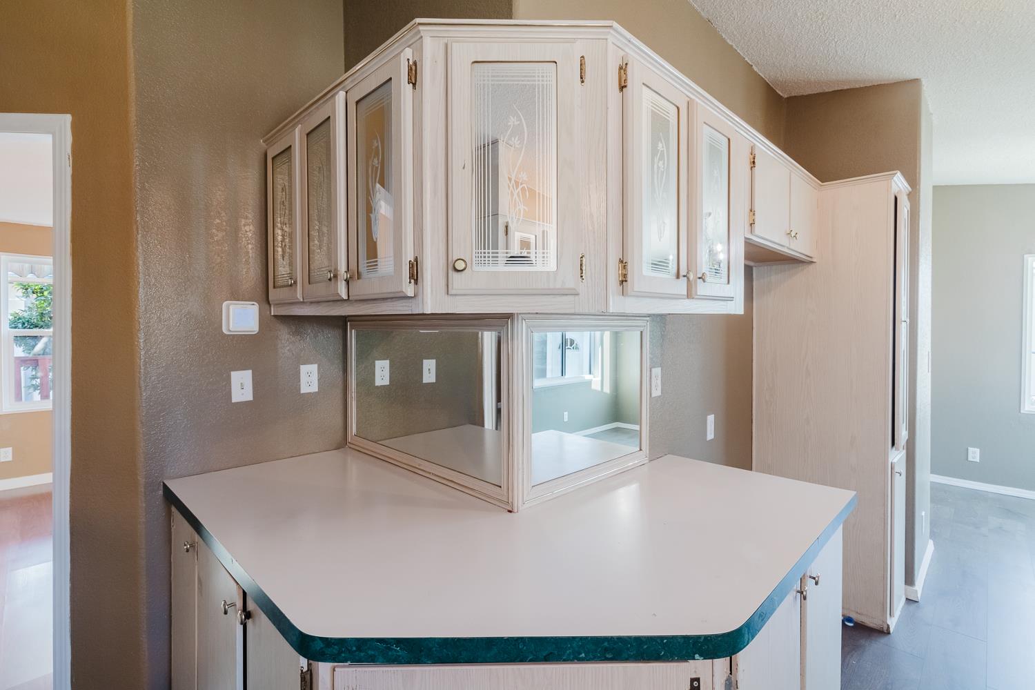 216 California Loop Sacramento, CA 95823 - Photo 22 of 42 a view of kitchen with granite countertop white cabinets and a refrigerator