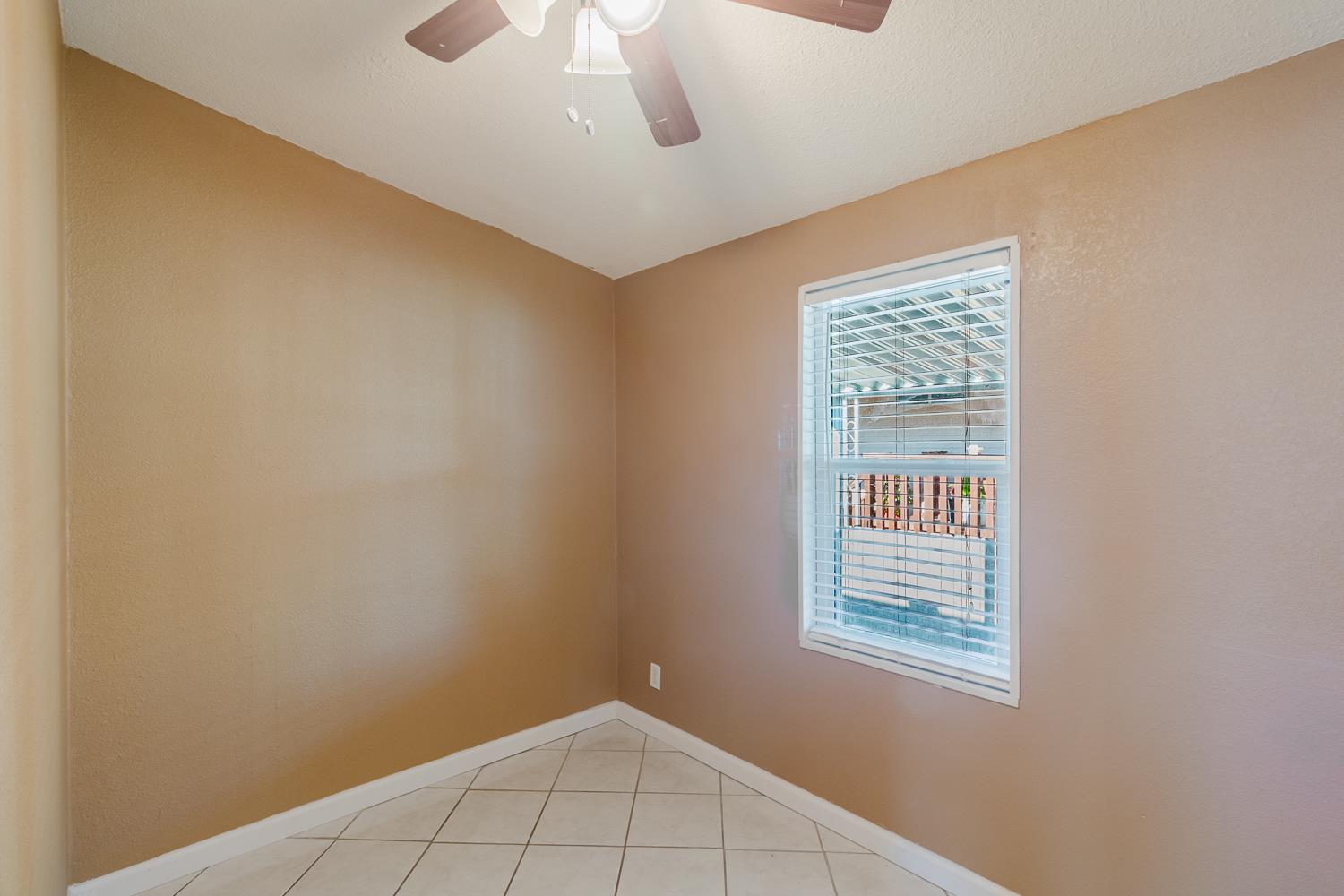 216 California Loop Sacramento, CA 95823 - Photo 30 of 42 an empty room with windows