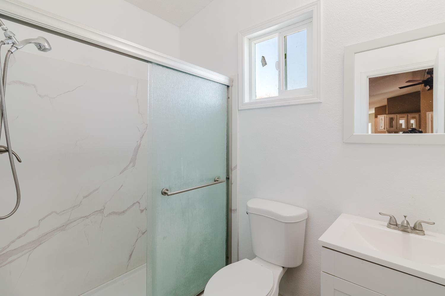 216 California Loop Sacramento, CA 95823 - Photo 32 of 42 a white toilet sitting next to a bathroom sink