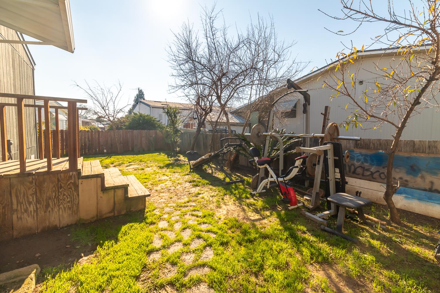 216 California Loop Sacramento, CA 95823 - Photo 39 of 42 a view of a backyard with a wooden fence