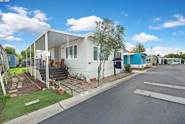 a view of a house with wooden fence