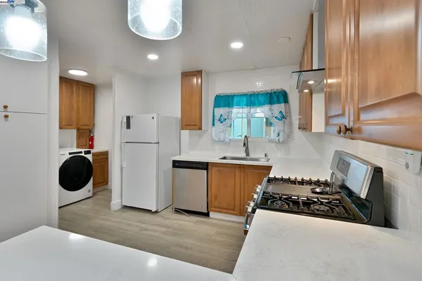 a view of kitchen with wooden floor