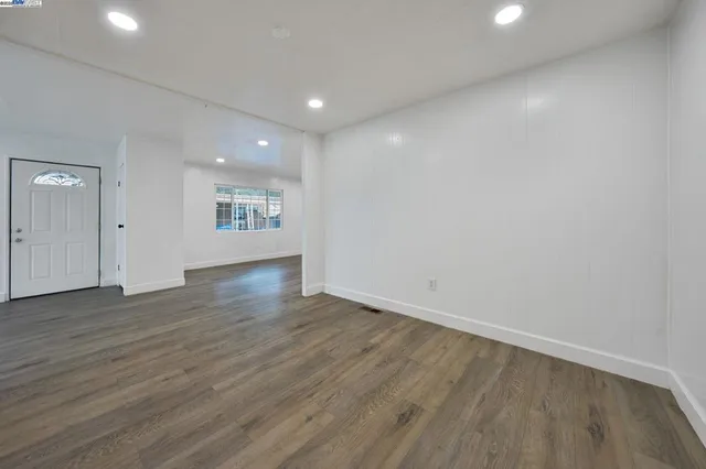 a bedroom with bed and cabinets