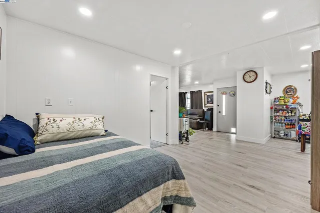 a spacious bedroom with a bed and a large closet