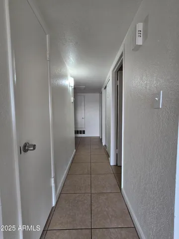 a view of a hallway with a door
