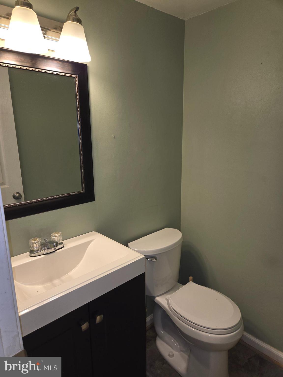 1850 Aberdeen Circle Crofton, MD 21114 - Photo 14 of 26 a bathroom with a toilet sink and mirror