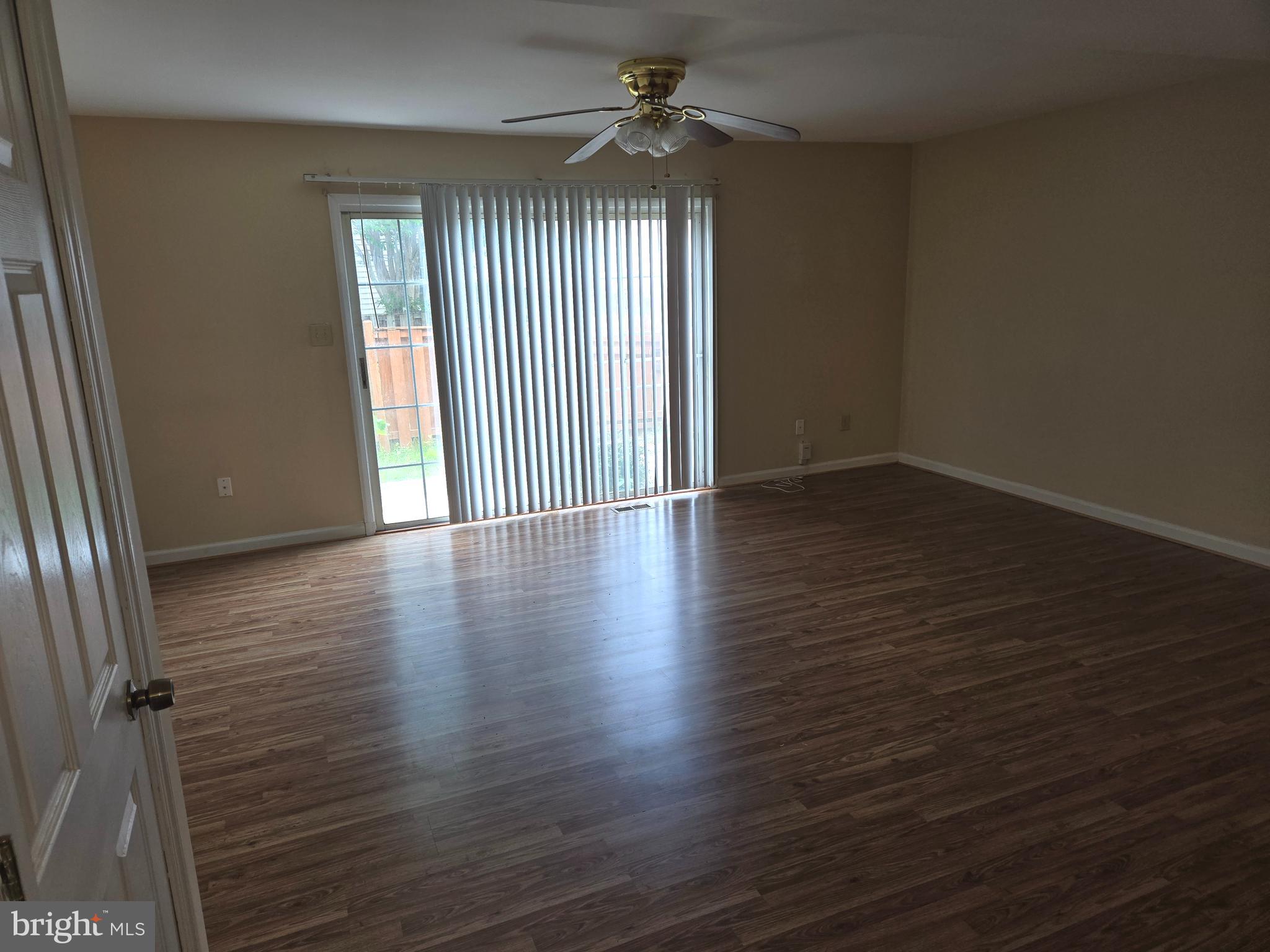 1850 Aberdeen Circle Crofton, MD 21114 - Photo 6 of 26 an empty room with wooden floor and windows