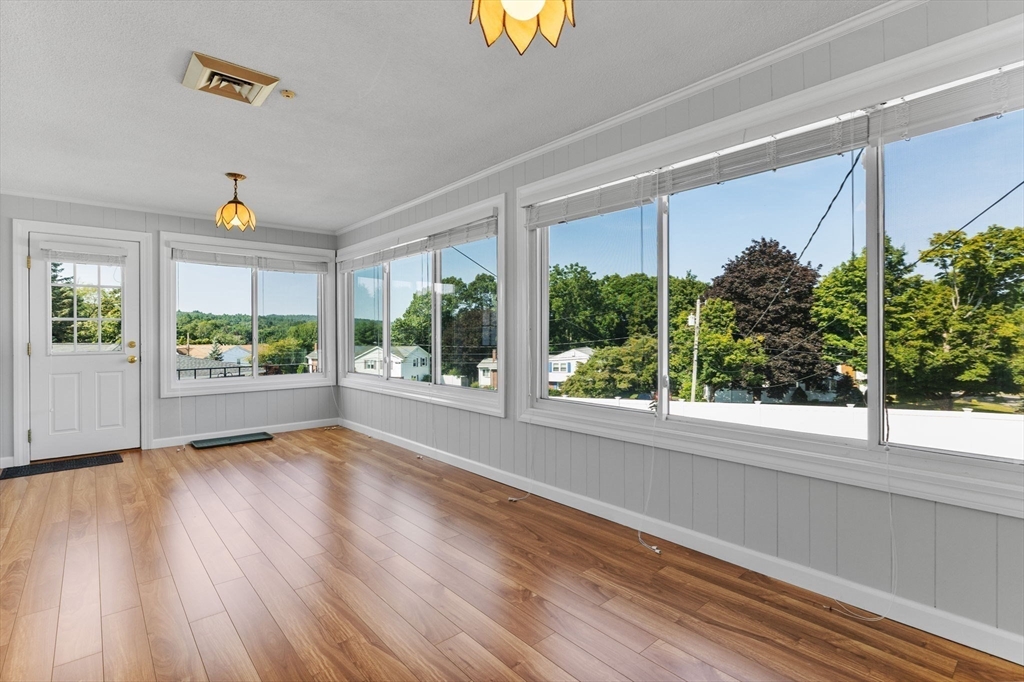 63 Sears Road Milton, MA 02186 - Photo 16 of 42 a view of room with window and wooden floor