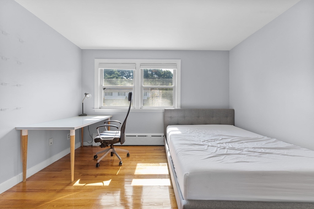 63 Sears Road Milton, MA 02186 - Photo 20 of 42 a bedroom with a bed and windows