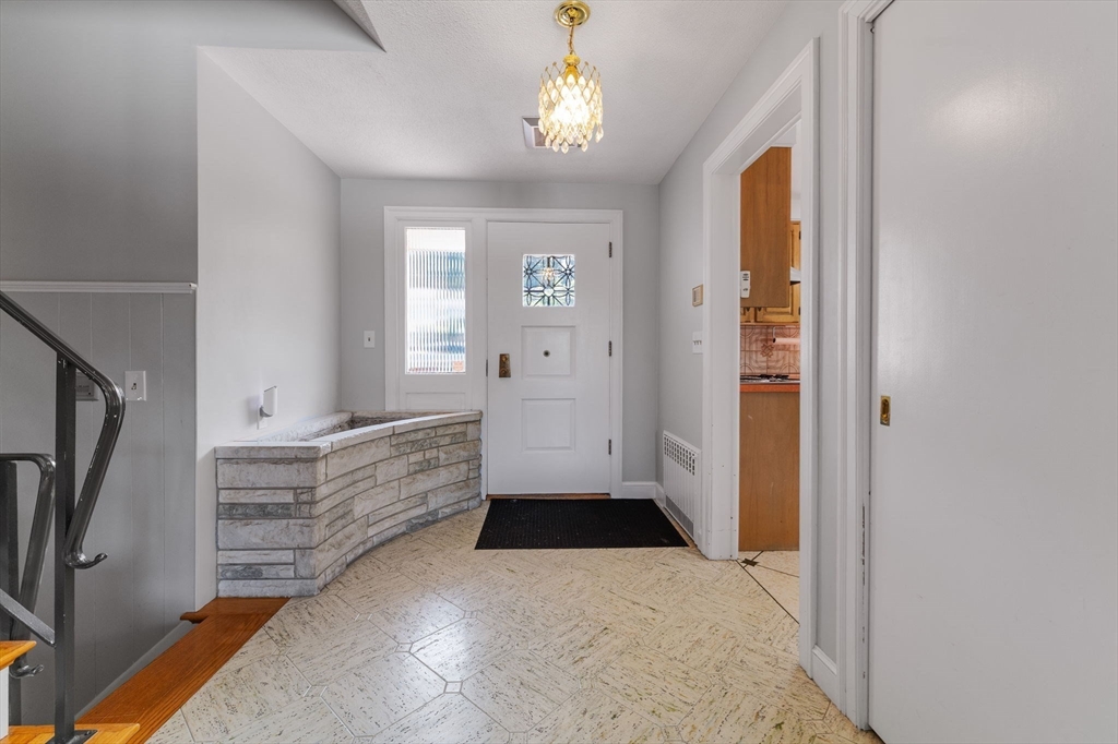 63 Sears Road Milton, MA 02186 - Photo 29 of 42 a view of entryway with window and hallway