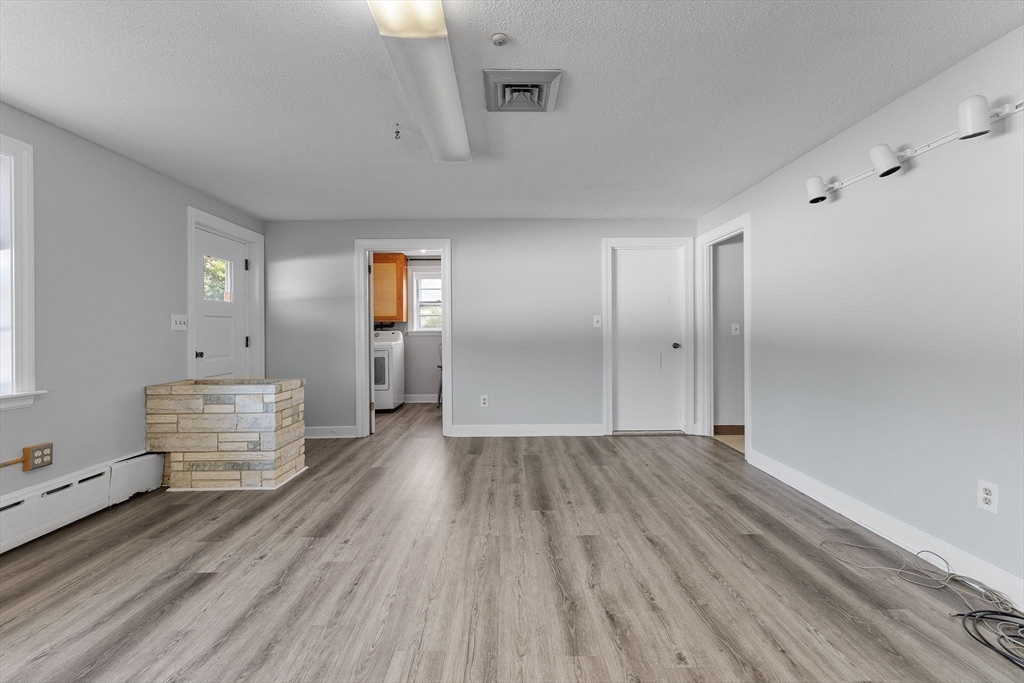 63 Sears Road Milton, MA 02186 - Photo 30 of 42 wooden floor in an empty room