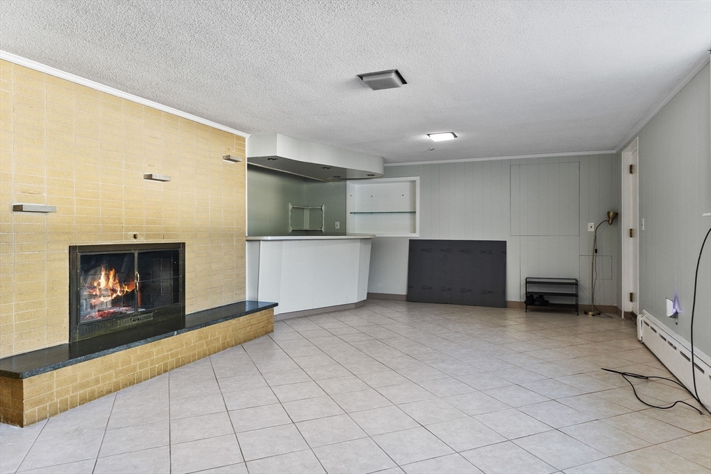 63 Sears Road Milton, MA 02186 - Photo 38 of 42 a view of a livingroom with a fireplace