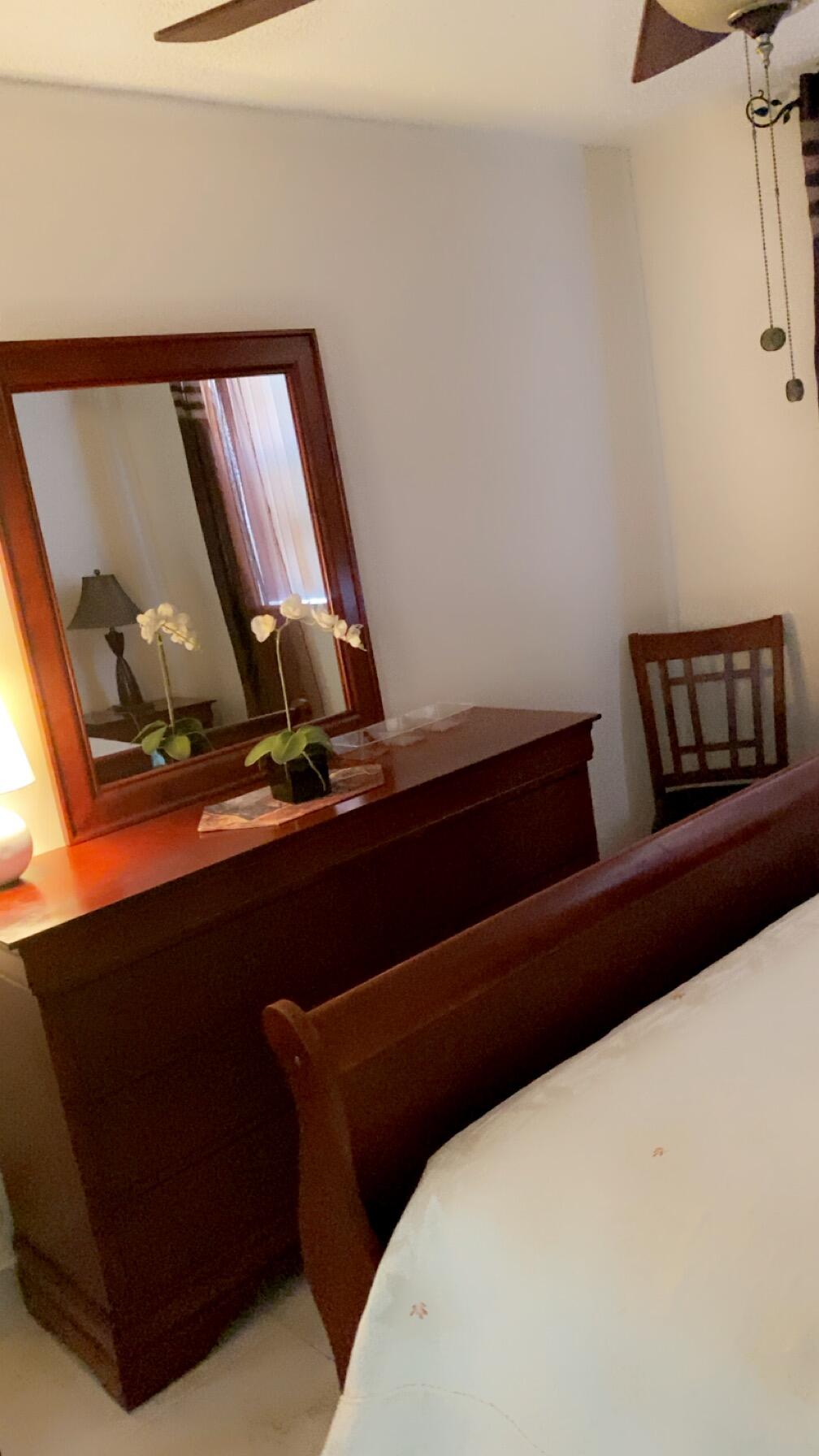 3000 Northwest 48th Terrace, Unit 422 Lauderdale Lakes, FL 33313 - Photo 6 of 9 a bedroom with a bed and window