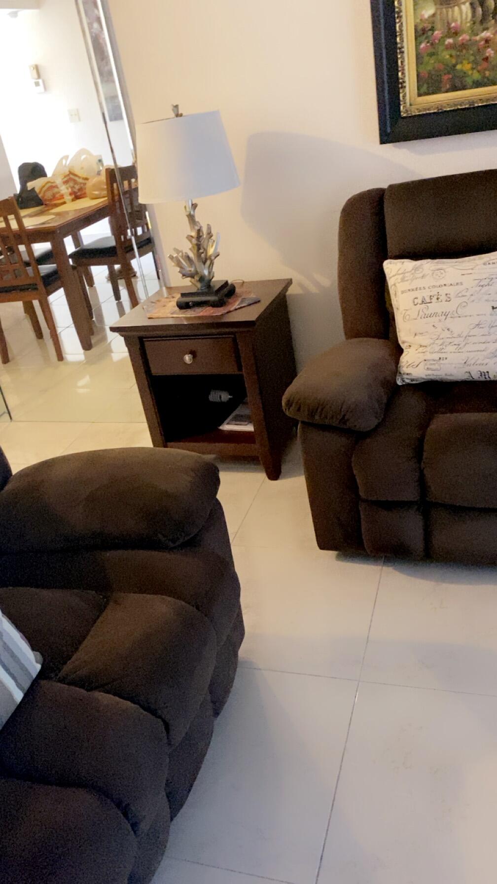 3000 Northwest 48th Terrace, Unit 422 Lauderdale Lakes, FL 33313 - Photo 9 of 9 a living room with furniture and a couch