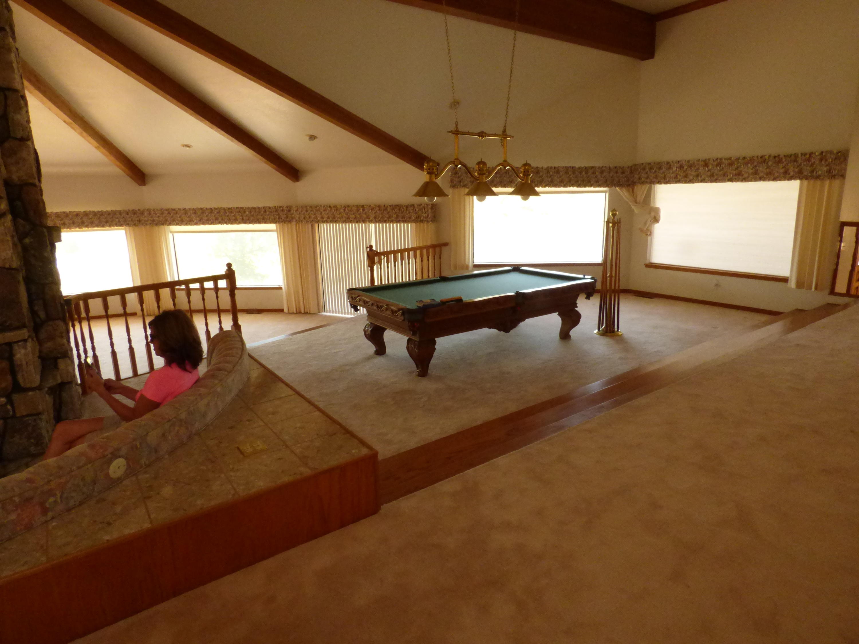 26602 Snider Ranch Road Oak Run, CA 96069 - Photo 16 of 18 a room with lots of furniture and a chandelier