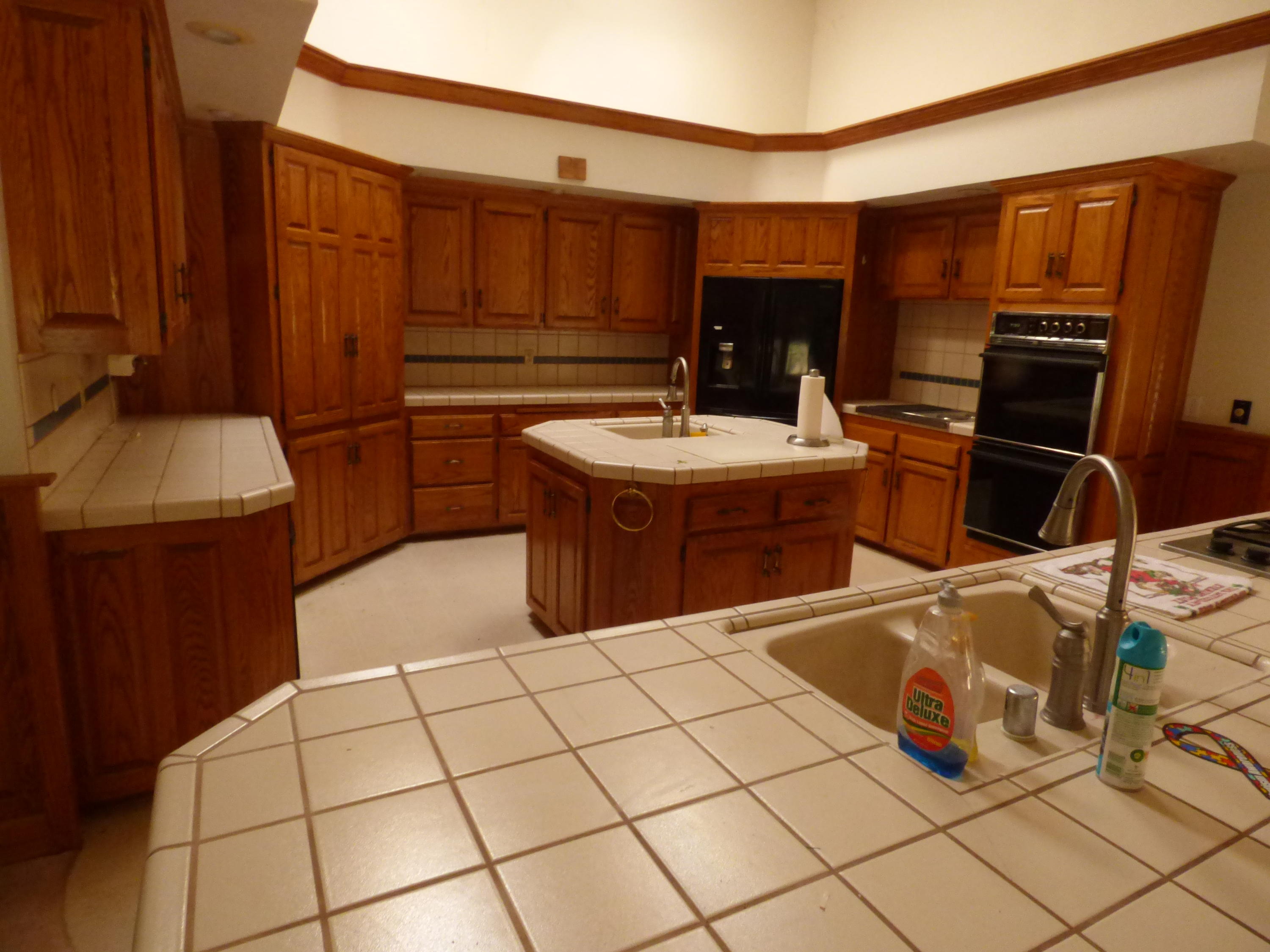 26602 Snider Ranch Road Oak Run, CA 96069 - Photo 17 of 18 a kitchen with a stove a refrigerator and cabinets