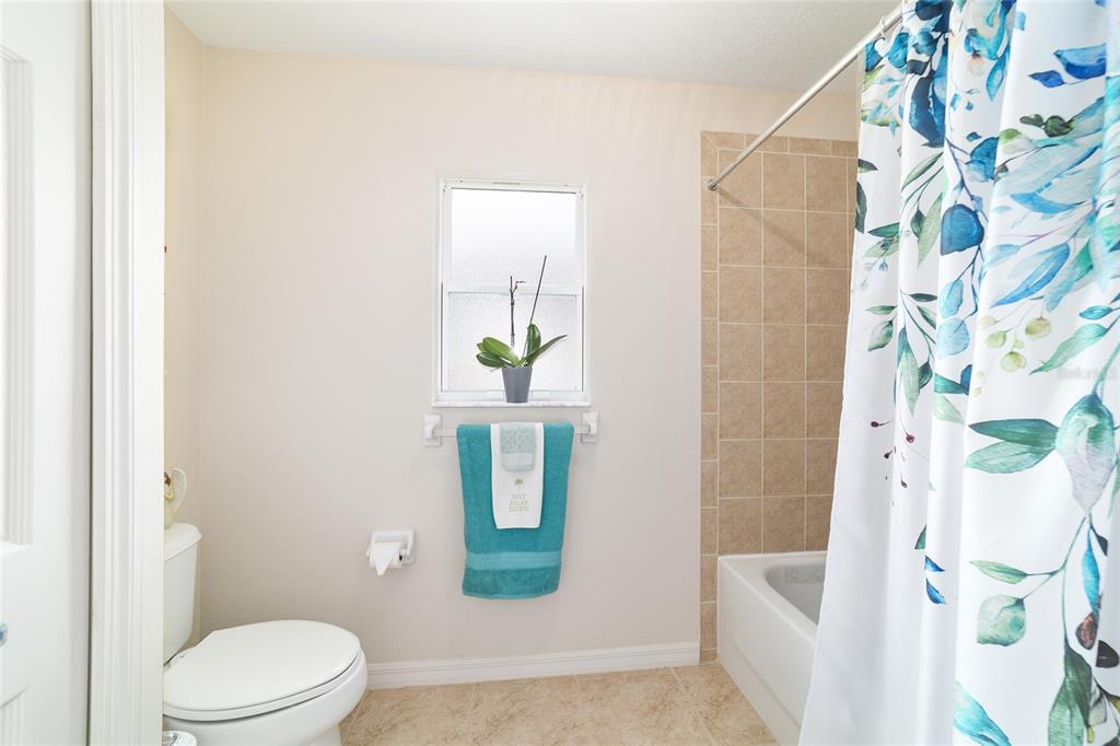 1056 Southwest 159th Street Ocala, FL 34473 - Photo 22 of 45 a white toilet sitting next to a bath tub