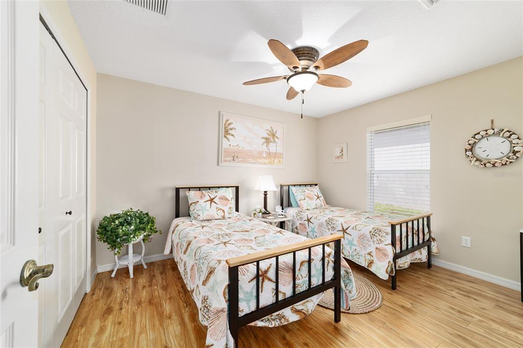 1056 Southwest 159th Street Ocala, FL 34473 - Photo 23 of 45 a bedroom with a bed table and a window