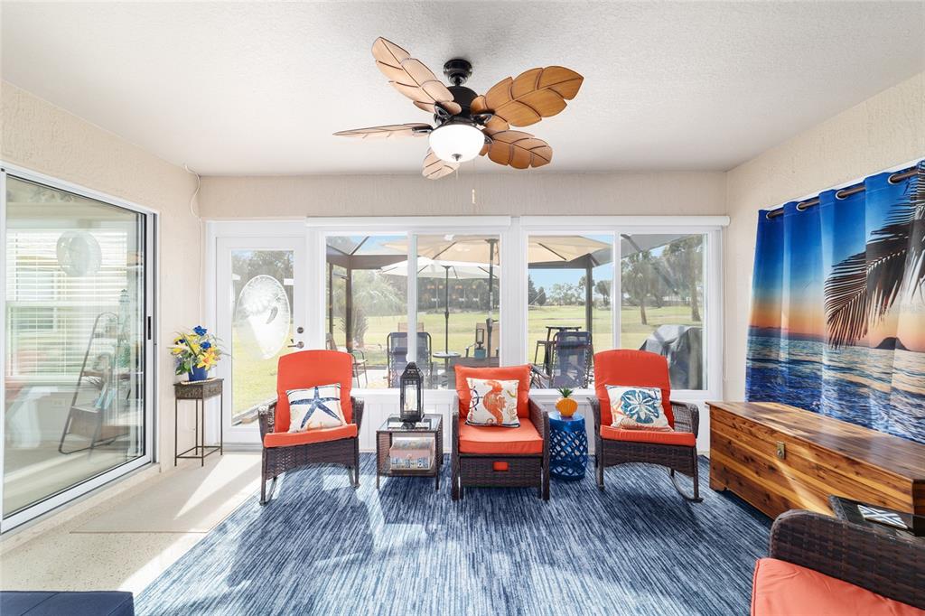 1056 Southwest 159th Street Ocala, FL 34473 - Photo 28 of 45 a living room with furniture and a floor to ceiling window