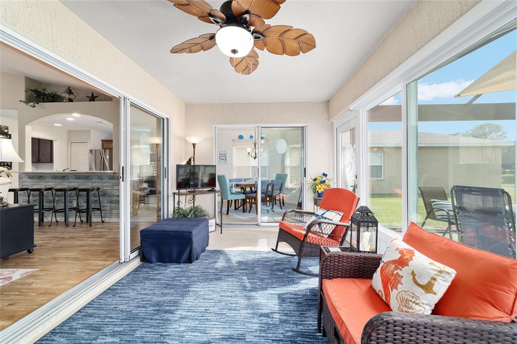 1056 Southwest 159th Street Ocala, FL 34473 - Photo 30 of 45 a living room with furniture and a floor to ceiling window