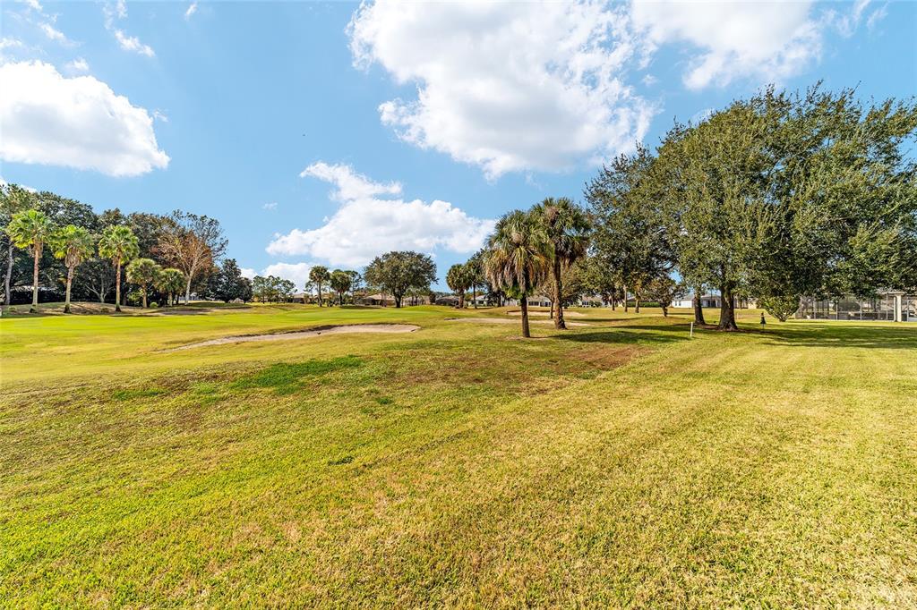 1056 Southwest 159th Street Ocala, FL 34473 - Photo 38 of 45 a view of a swimming pool with an outdoor space and seating area