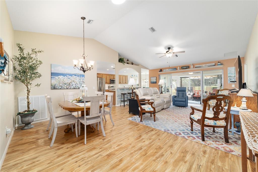 1056 Southwest 159th Street Ocala, FL 34473 - Photo 7 of 45 a living room with lots of furniture and a wooden floor