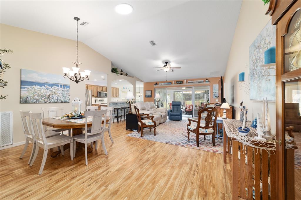 1056 Southwest 159th Street Ocala, FL 34473 - Photo 8 of 45 a view of a dining room with furniture window and wooden floor