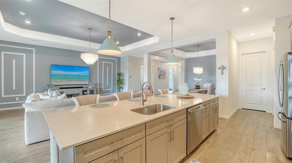 12716 Tulum Loop Venice, FL 34293 - Photo 14 of 97 a kitchen with sink refrigerator and window