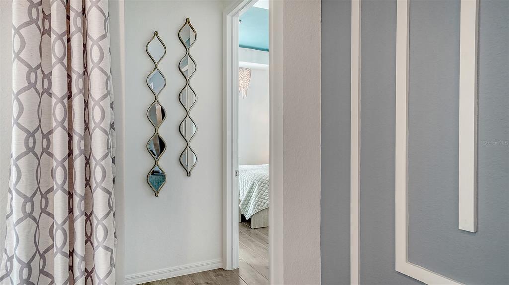 12716 Tulum Loop Venice, FL 34293 - Photo 16 of 97 a bathroom with a bathtub and shower curtain