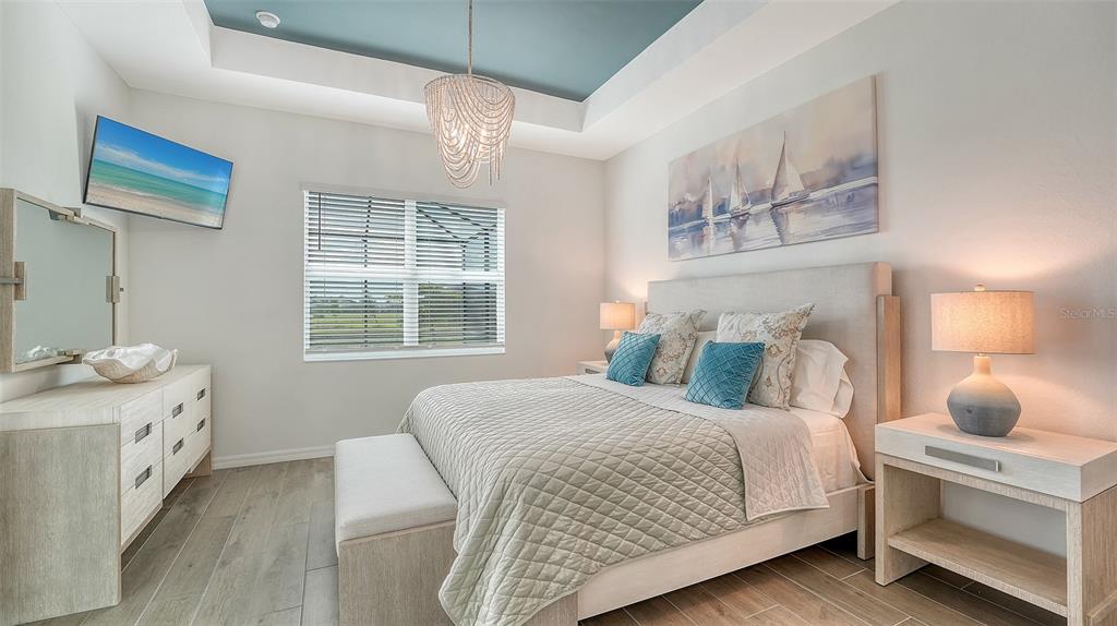 12716 Tulum Loop Venice, FL 34293 - Photo 17 of 97 a bedroom with a bed and a window