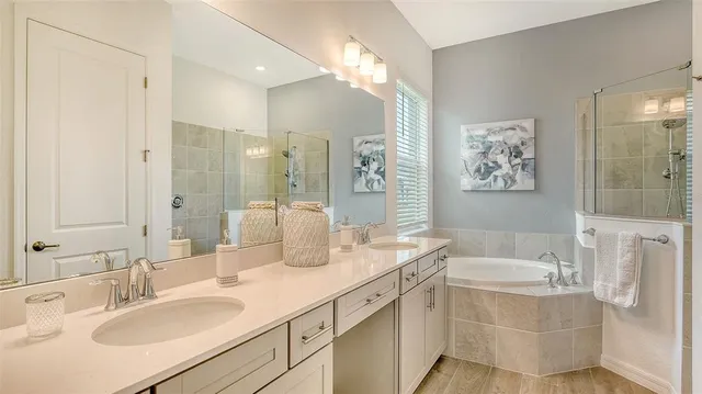 a view of a patio with a table chairs and a floor to ceiling window