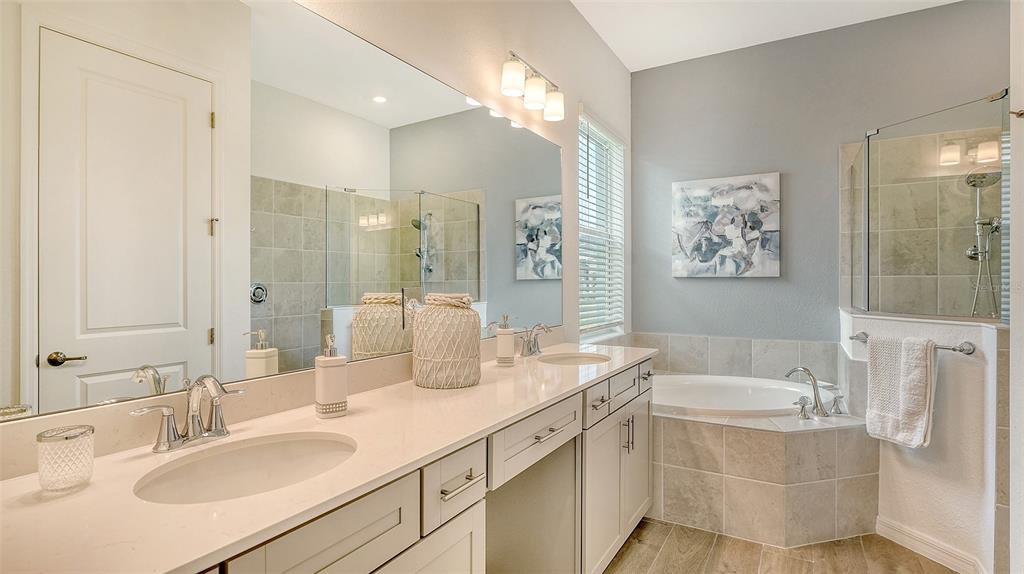 12716 Tulum Loop Venice, FL 34293 - Photo 21 of 97 a bathroom with a granite countertop sink mirror and a