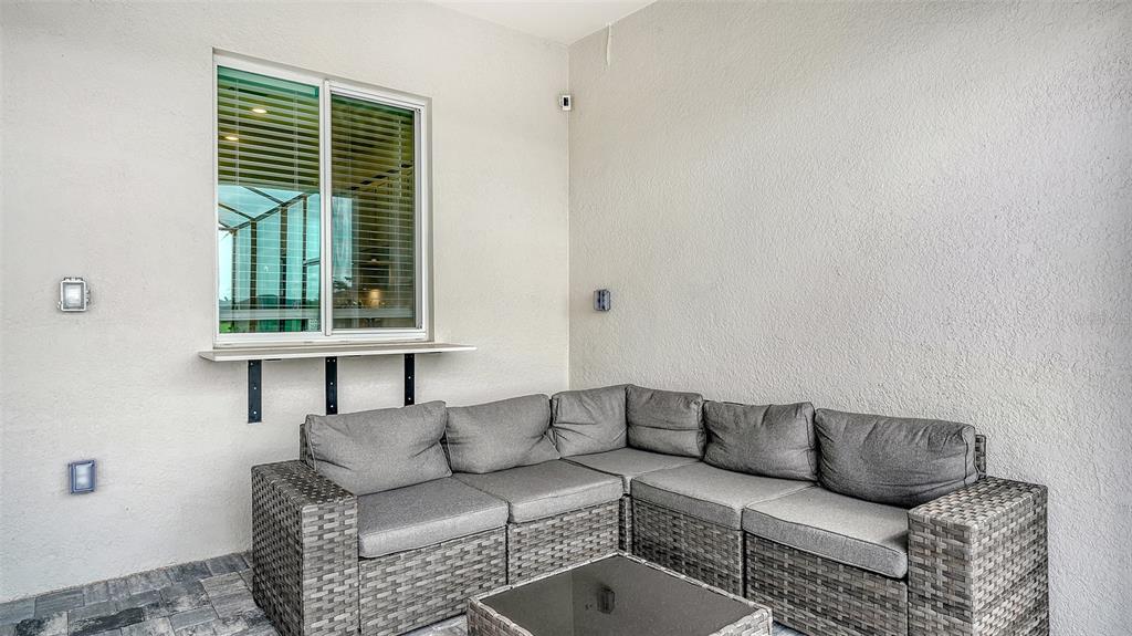 12716 Tulum Loop Venice, FL 34293 - Photo 34 of 97 a living room with furniture and a window