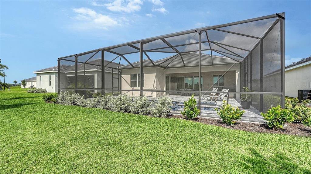 12716 Tulum Loop Venice, FL 34293 - Photo 40 of 97 front view of a house with a yard