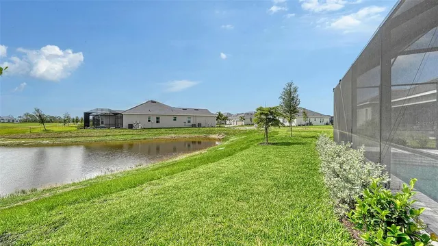 a front view of house with a garden