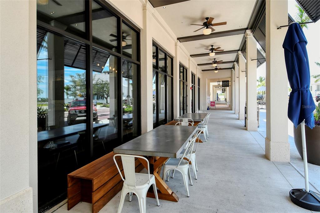 12716 Tulum Loop Venice, FL 34293 - Photo 68 of 97 a dining room with furniture and window