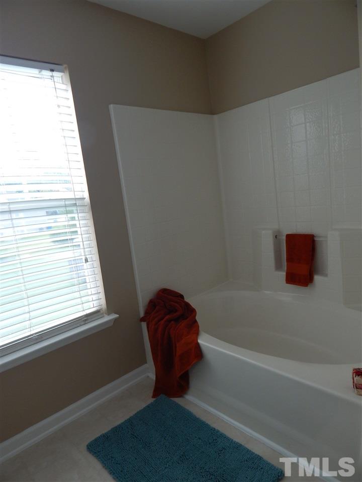 3604 Croydon Mill Way Raleigh, NC 27616 - Photo 8 of 13 a bathroom with a bathtub