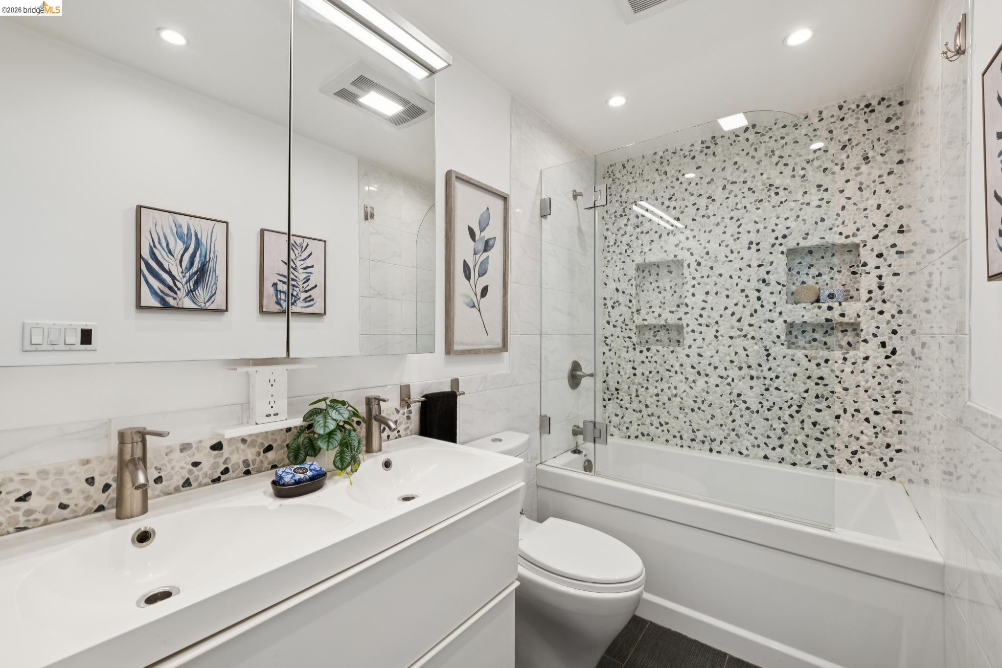 7 Embarcadero, Unit 204 Oakland, CA 94607 - Photo 14 of 27 Full bath featuring double vanity, shower / washtub combination, tile walls, and recessed lighting